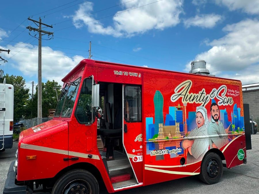 Aunty and Son red food truck seen from the driver side with the entry door open